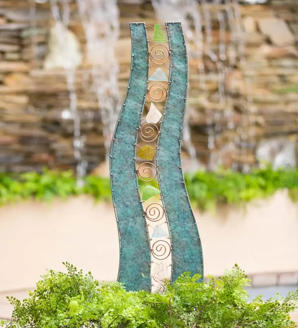 wavy metal and glass garden sculpture